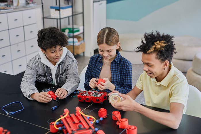 children doing robotics while having fun